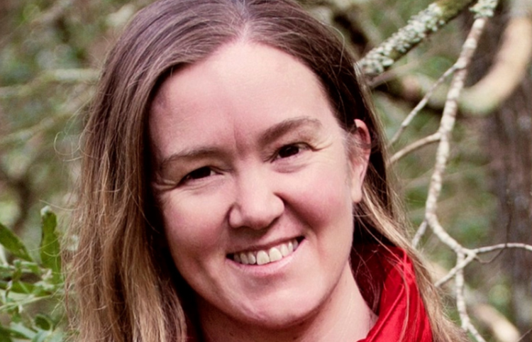 Headshot of author tania maloney in front of trees.