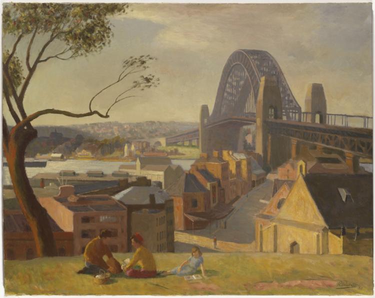 A family sitting on the grass in front of the Sydney Harbour Bridge