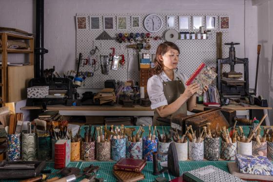 Isabelle McGowan at work in her Owl and Lion Bindery