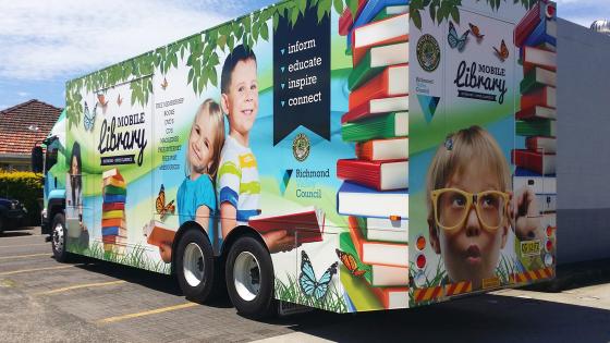 Mobile library truck with pictures of children and books