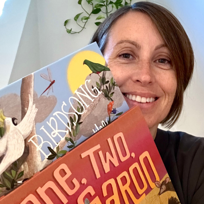 Author Kate James posing with two children's books