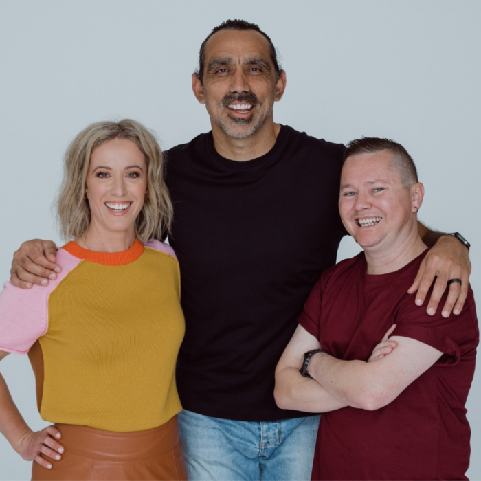 Adam Goodes, Ellie Laing and David Hardy STANDING WITH ARMS AROUND SHOULDERS