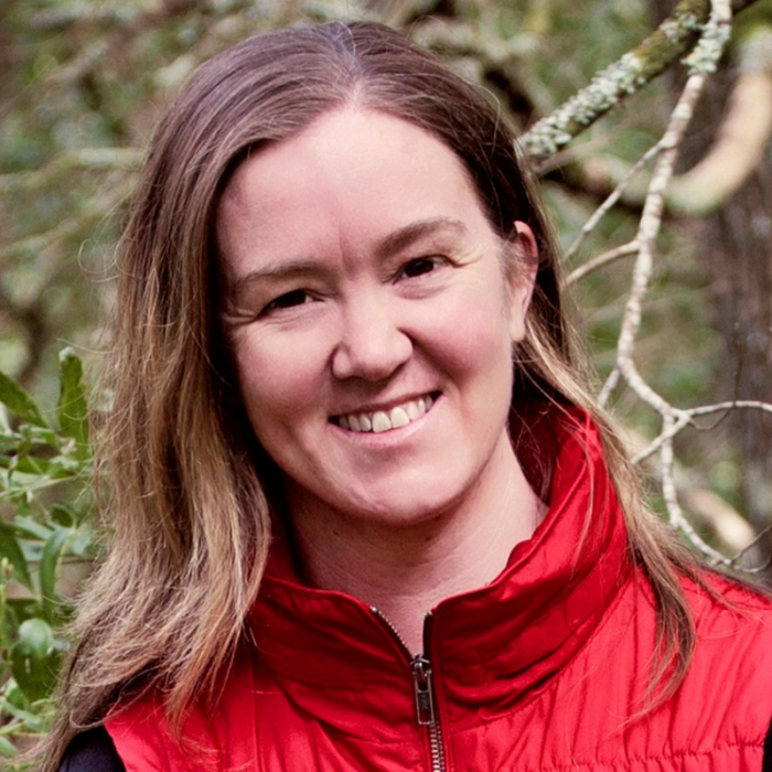 Headshot of author tania maloney in front of trees.