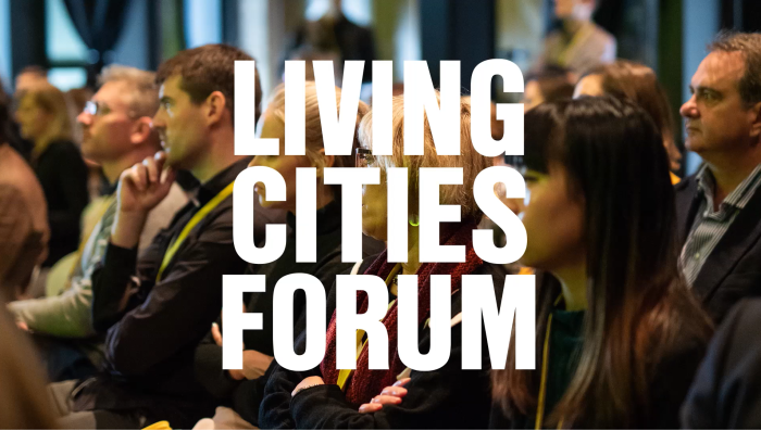 Living cities forum text over photo of crowd